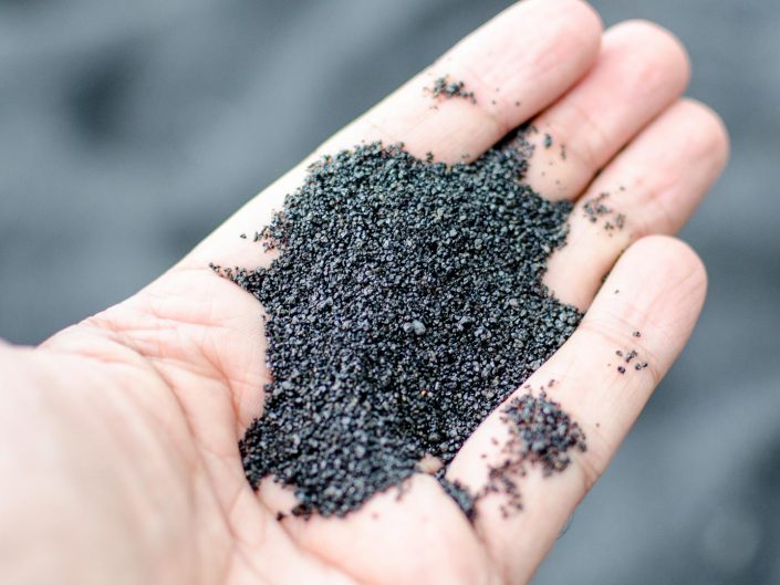 black sand in hawaii made of tiny pieces of lava